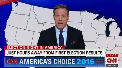 Jake Tapper presenting live news via CNN.